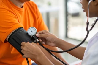 Doctor taking blood pressure